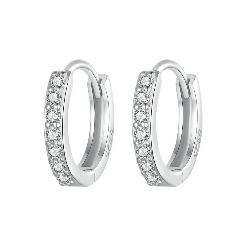 Sterling silver huggies style earrings set with cubic zirconia